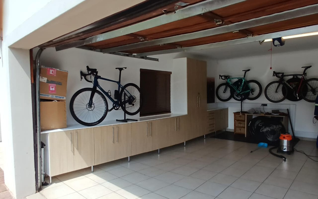 a bike is on a shelf in a garage